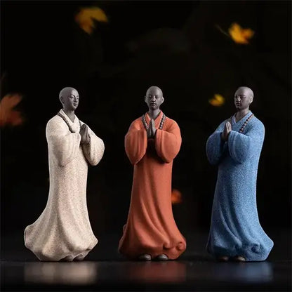 3 Statues Moine Bouddhiste Zen Méditative Décorative blanc rouge bleu sur fond noir kaosix